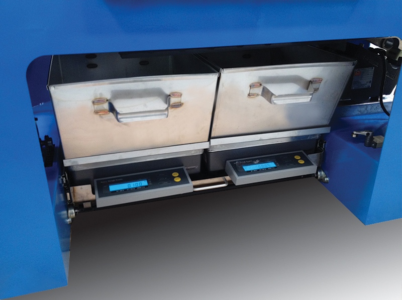 Close-up view of the Jeffrey Rader® CC4000 Chip Classifier sample collection bins with integrated digital scales for measuring classified wood chip fractions.