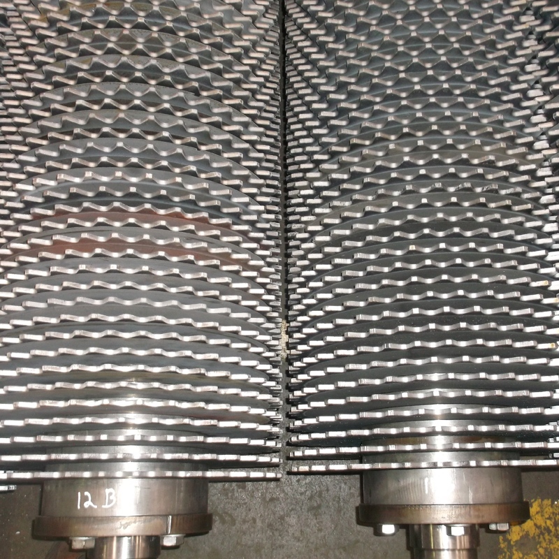 Close-up view of intermeshing disc shafts inside a Jeffrey Rader® Rader Disc Screen (RDS) used for precise material sizing and separation.