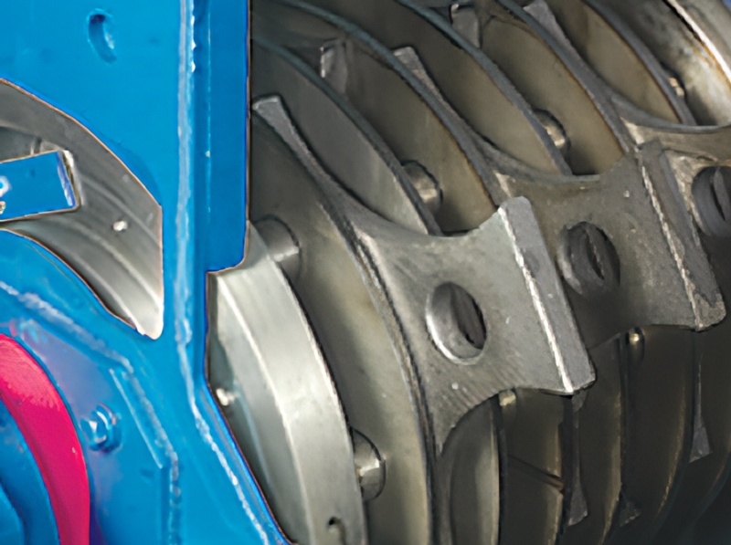 Close-up view of Jeffrey Rader® Mini Mill hammer assembly showing heavy-duty hammers and rotor discs inside the grinding chamber.