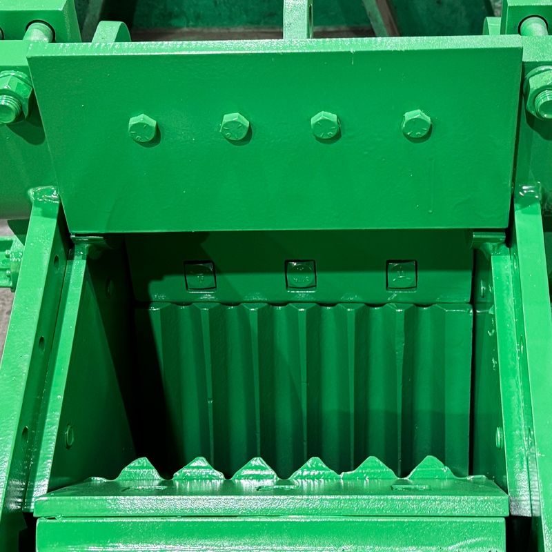 Close-up view of the feed opening and corrugated jaw plates inside a Pennsylvania Crusher double toggle jaw crusher.