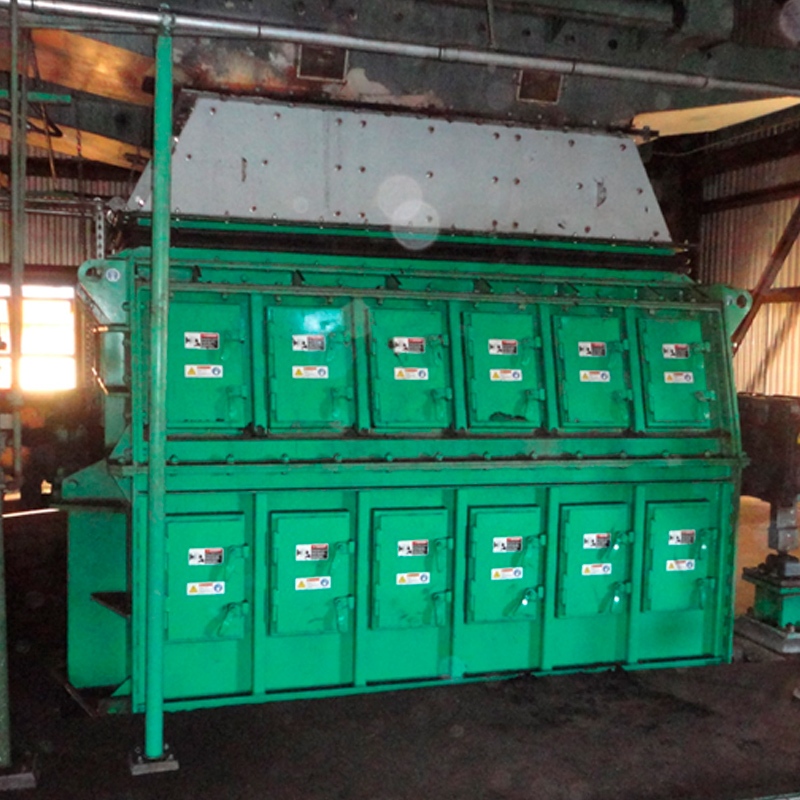 Pennsylvania Crusher POSIFLOW™ feeder installed in an industrial facility with enclosed housing and multiple maintenance access doors for bulk material handling operations.