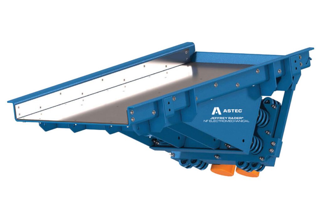 Jeffrey Rader® NFE electromechanical vibrating feeder with heavy-duty steel pan and natural frequency drive system for controlled bulk material feeding.