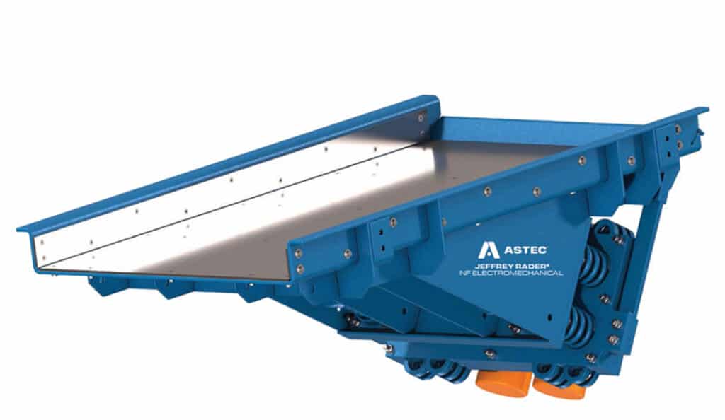 Jeffrey Rader® NFE electromechanical vibrating feeder with heavy-duty steel pan and natural frequency drive system for controlled bulk material feeding.