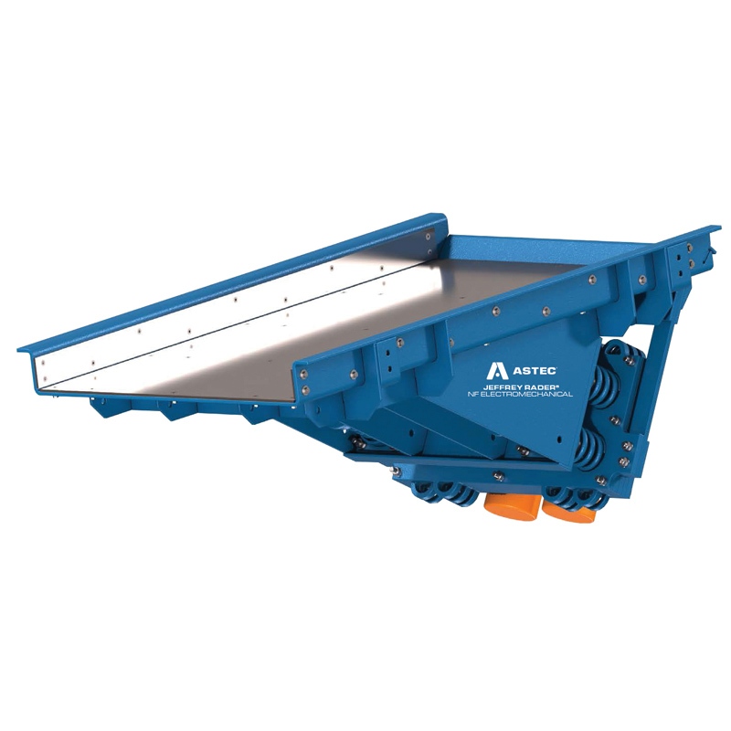 Jeffrey Rader® NFE electromechanical vibrating feeder with heavy-duty steel pan and natural frequency drive system for controlled bulk material feeding.